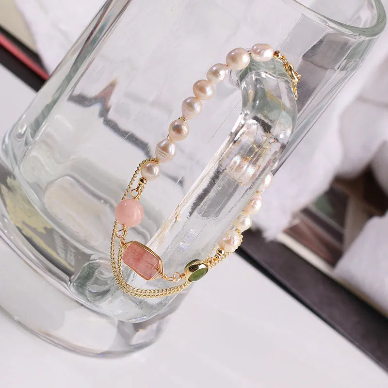 Women's pink bracelet with freshwater pearls and strawberry crystal charms in geometric design