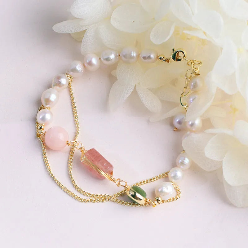Women's pink bracelet with freshwater pearls and strawberry crystal charms in geometric design