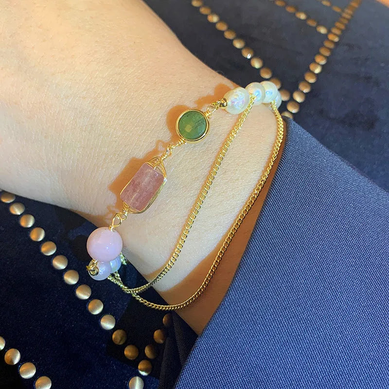 Women's pink bracelet with freshwater pearls and strawberry crystal charms in geometric design