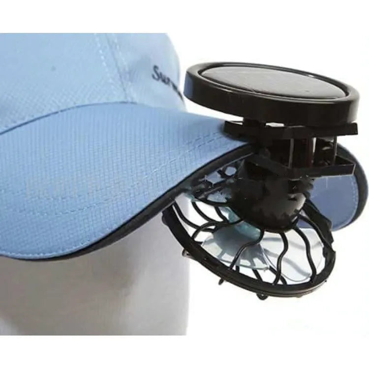 Black solar-powered clip-on fan with solar panel for outdoor cooling during camping and travel