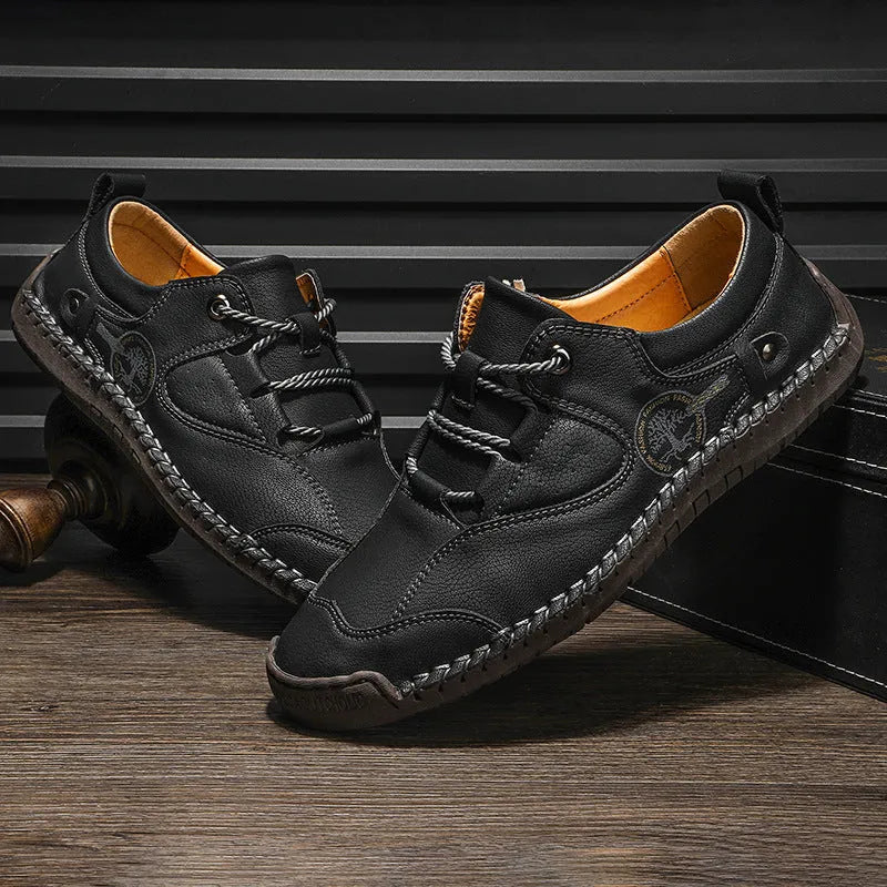Men's black microfiber casual shoes with round toe on plain background