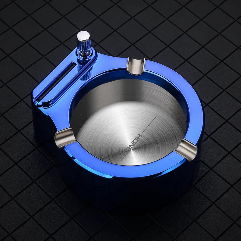 Large blue metal cigarette ashtray with a built-in permanent match lighter and three cigarette slots.
