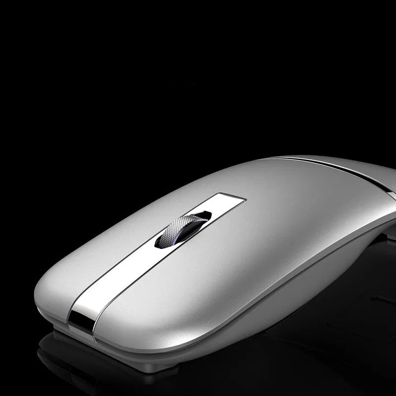 Crystal silver dual-mode Bluetooth wireless mouse with foldable ultra-thin design on a desk