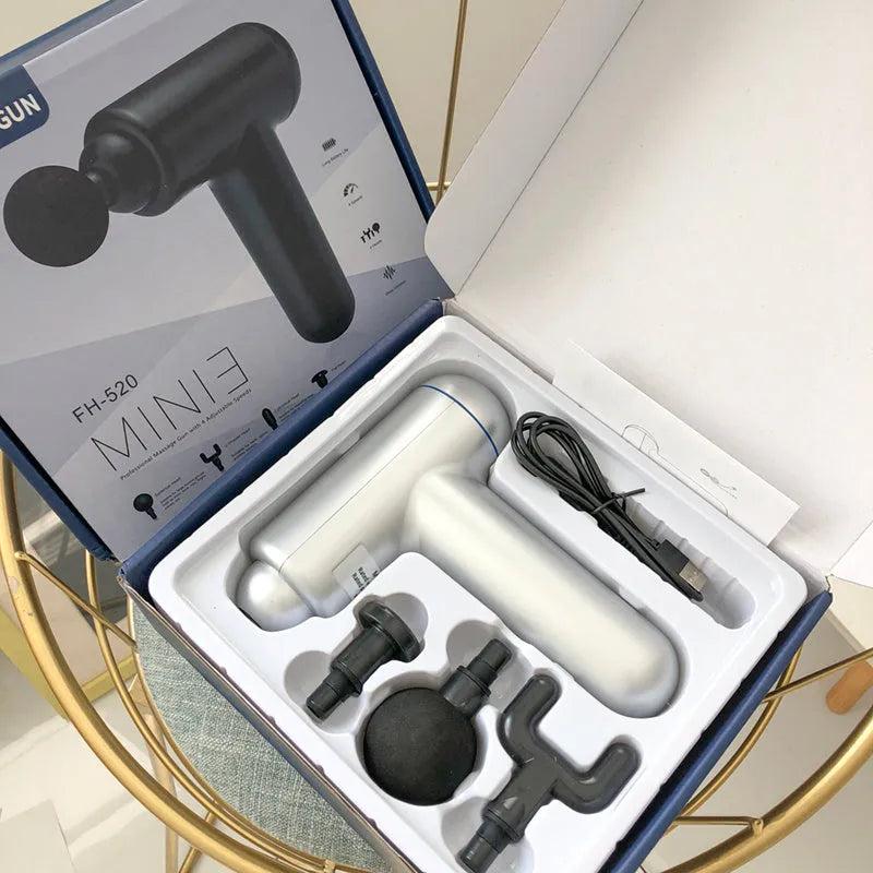 Grey fascia gun massager with USB charging port for muscle relaxation therapy