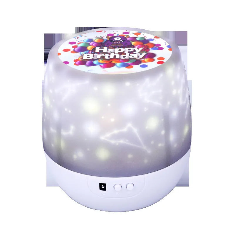 Starry sky projection lamp with plastic shade showing cosmic light patterns on a wall.