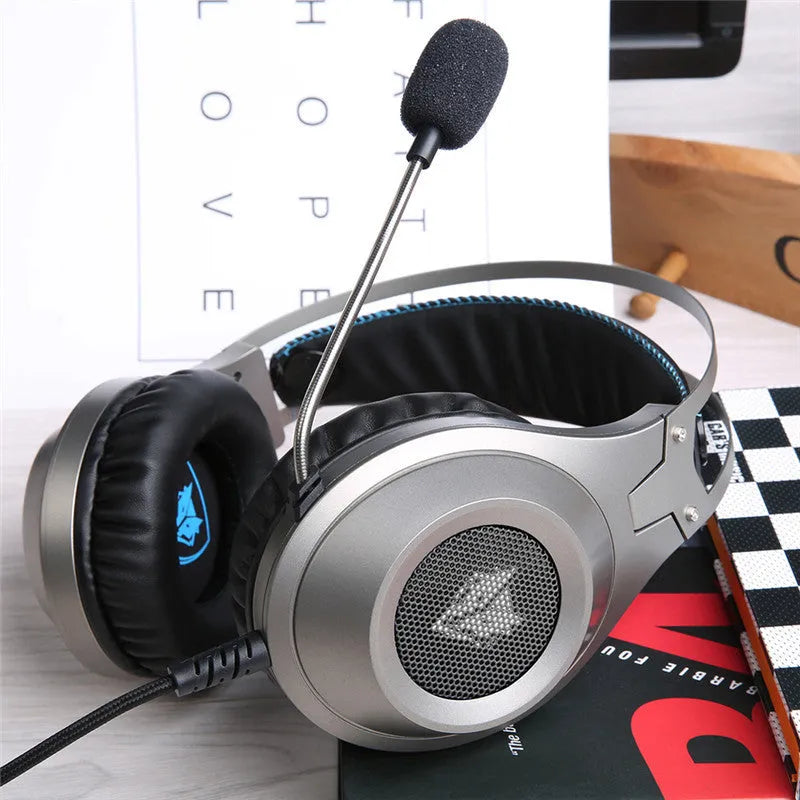 Black USB wired over-ear computer headset with a built-in microphone on a desktop