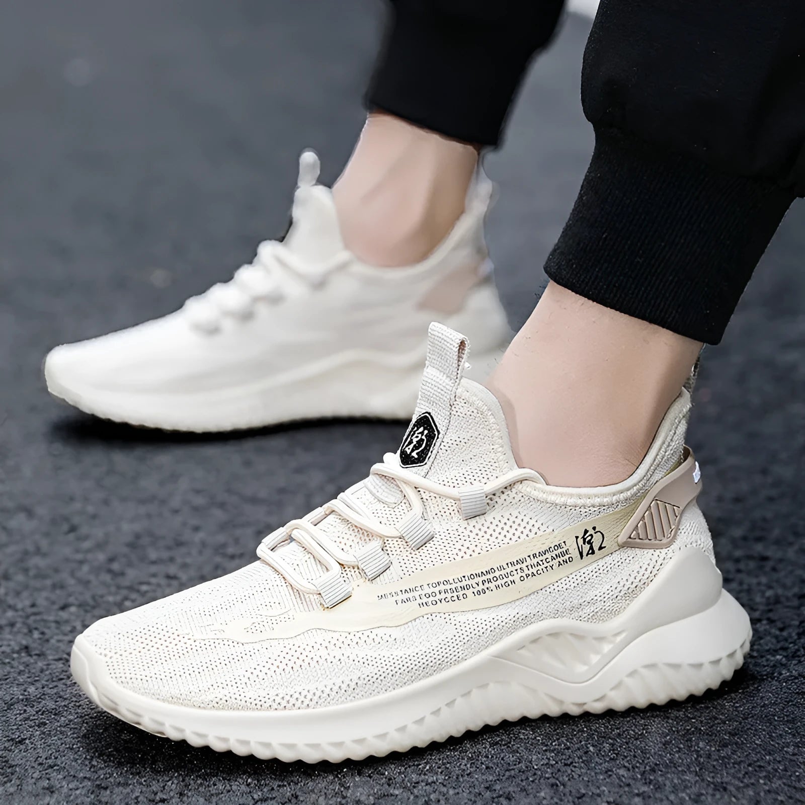 Men's low-top white mesh sports shoes with rubber sole and front lace closure.