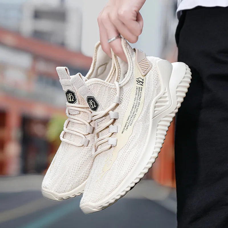 Men's low-top white mesh sports shoes with rubber sole and front lace closure.