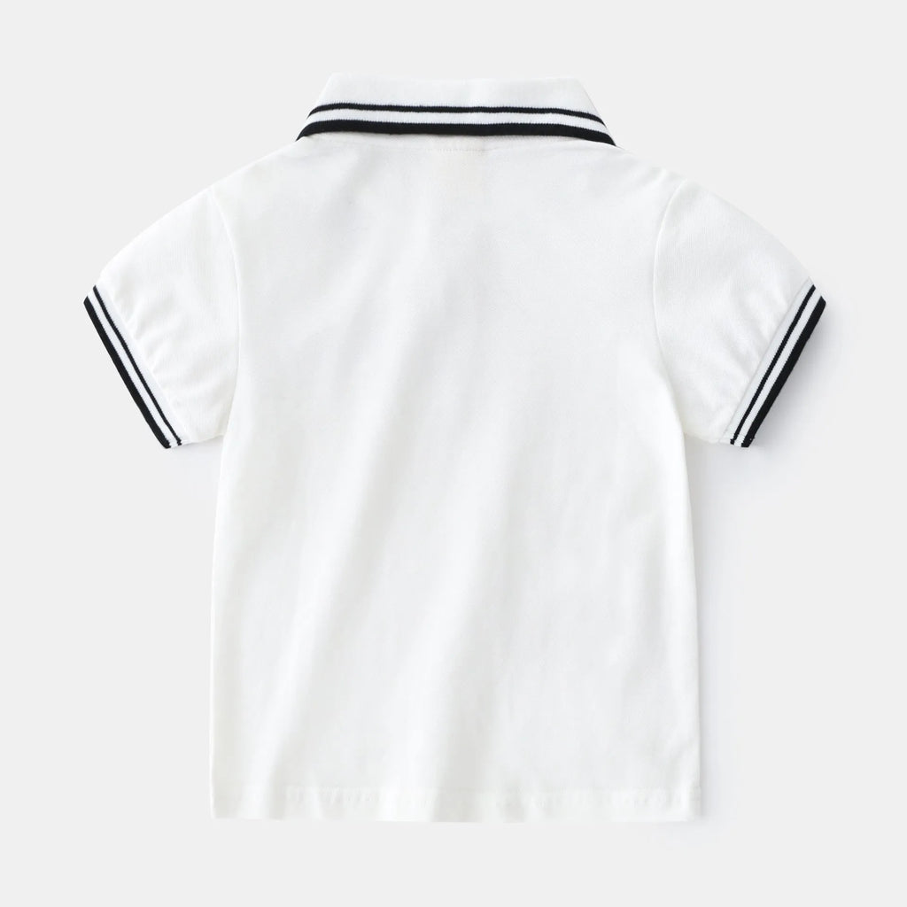Boys plain cotton polo shirt in white or black with short sleeves and round neck.