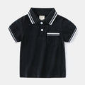 Boys plain cotton polo shirt in white or black with short sleeves and round neck.