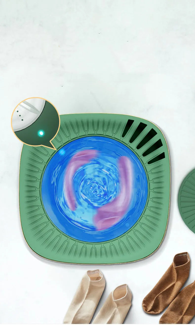Green and white mini portable automatic washing machine for underwear and socks on a countertop.