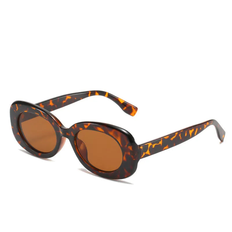 Women's oval fashion sunglasses with black frame and UV400 protection
