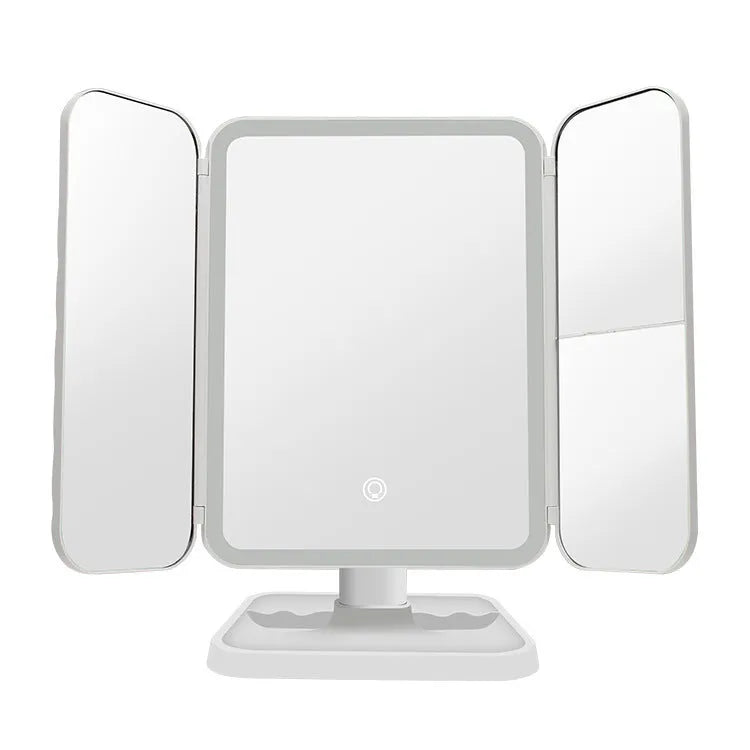Trifold LED makeup mirror with 68 lights, 10X magnifying mirror, and USB rechargeable battery on table