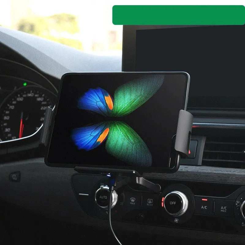 Black car clip-on wireless charger bracket holding a tablet in a car vent