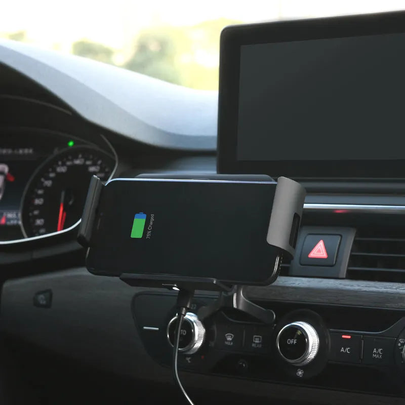 Black car clip-on wireless charger bracket holding a tablet in a car vent