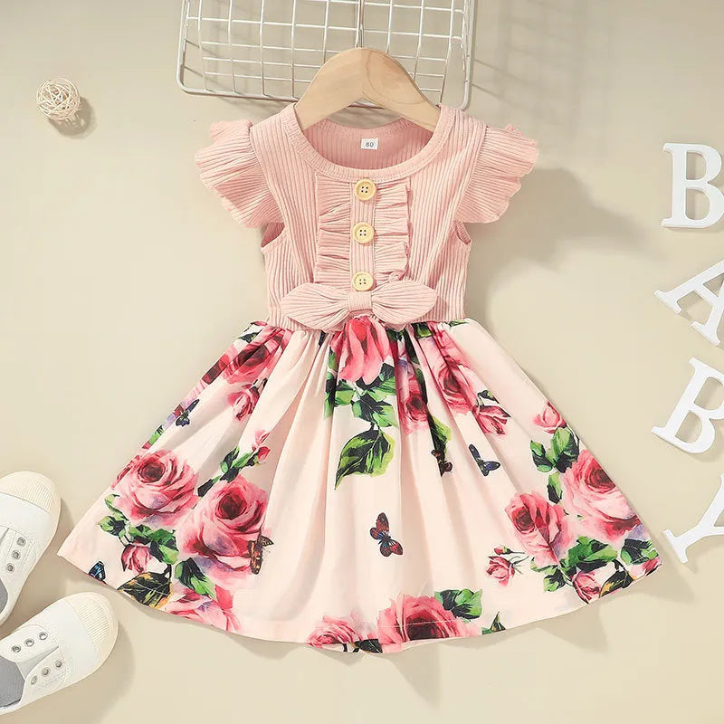 Sleeveless summer dress for toddler girl on a hanger, shown in one of the available colours.