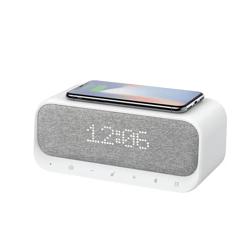 Anker Soundcore white Bluetooth speaker with wireless charging top and digital clock display.