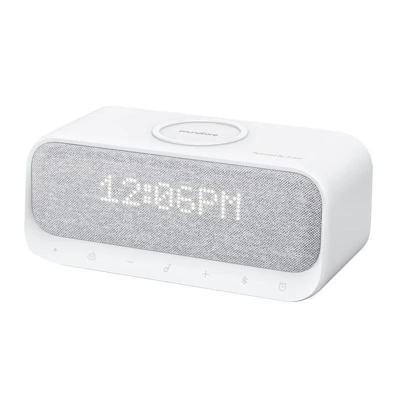 Anker Soundcore white Bluetooth speaker with wireless charging top and digital clock display.