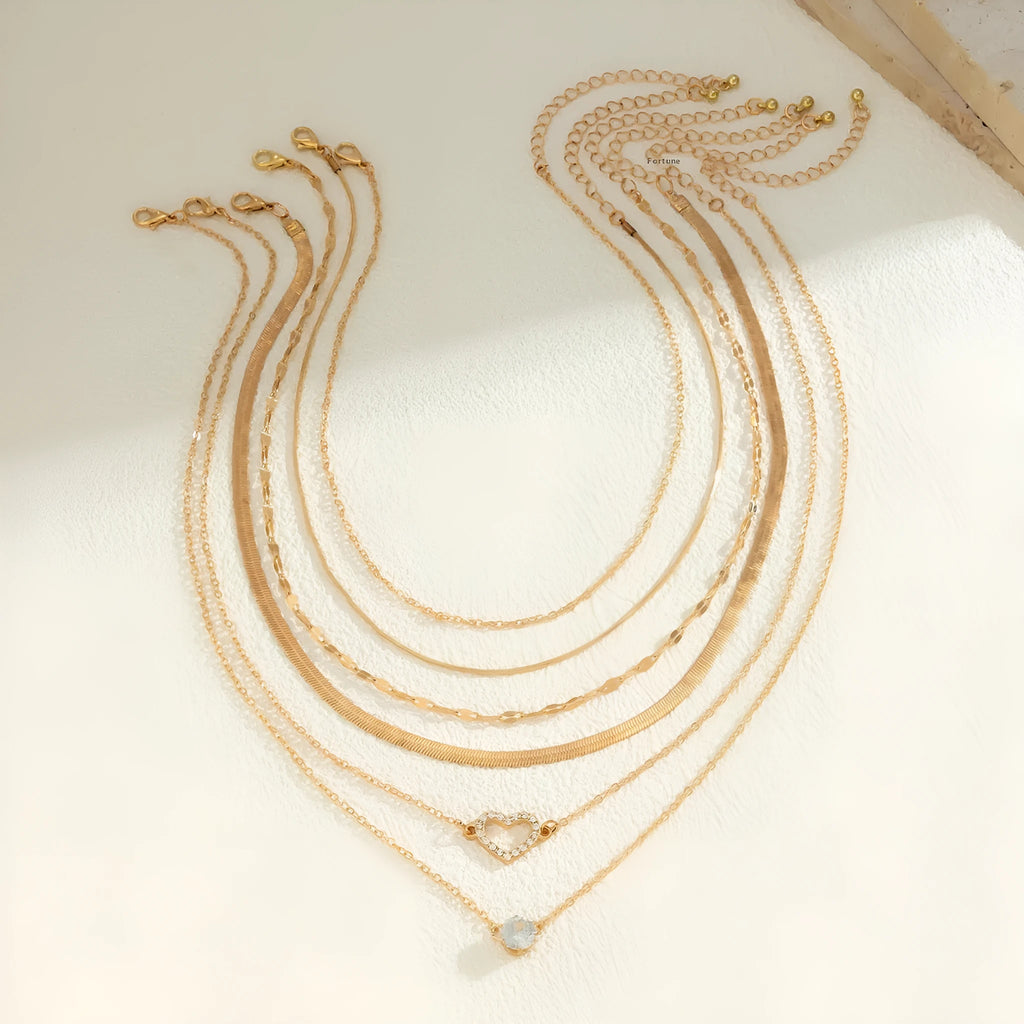 Women's snake bone chain contrast colour necklace with heart shape alloy pendant in gold and silver stitching