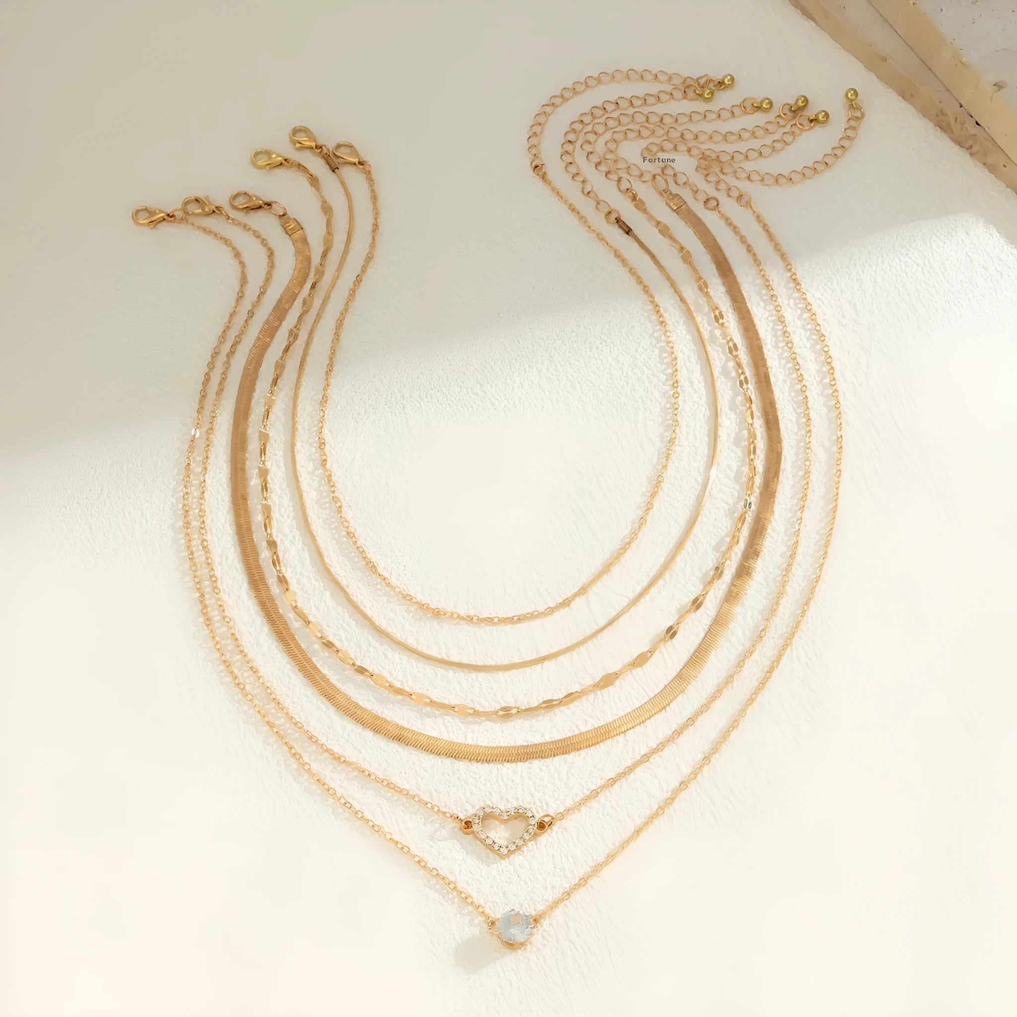 Women's snake bone chain contrast colour necklace with heart shape alloy pendant in gold and silver stitching