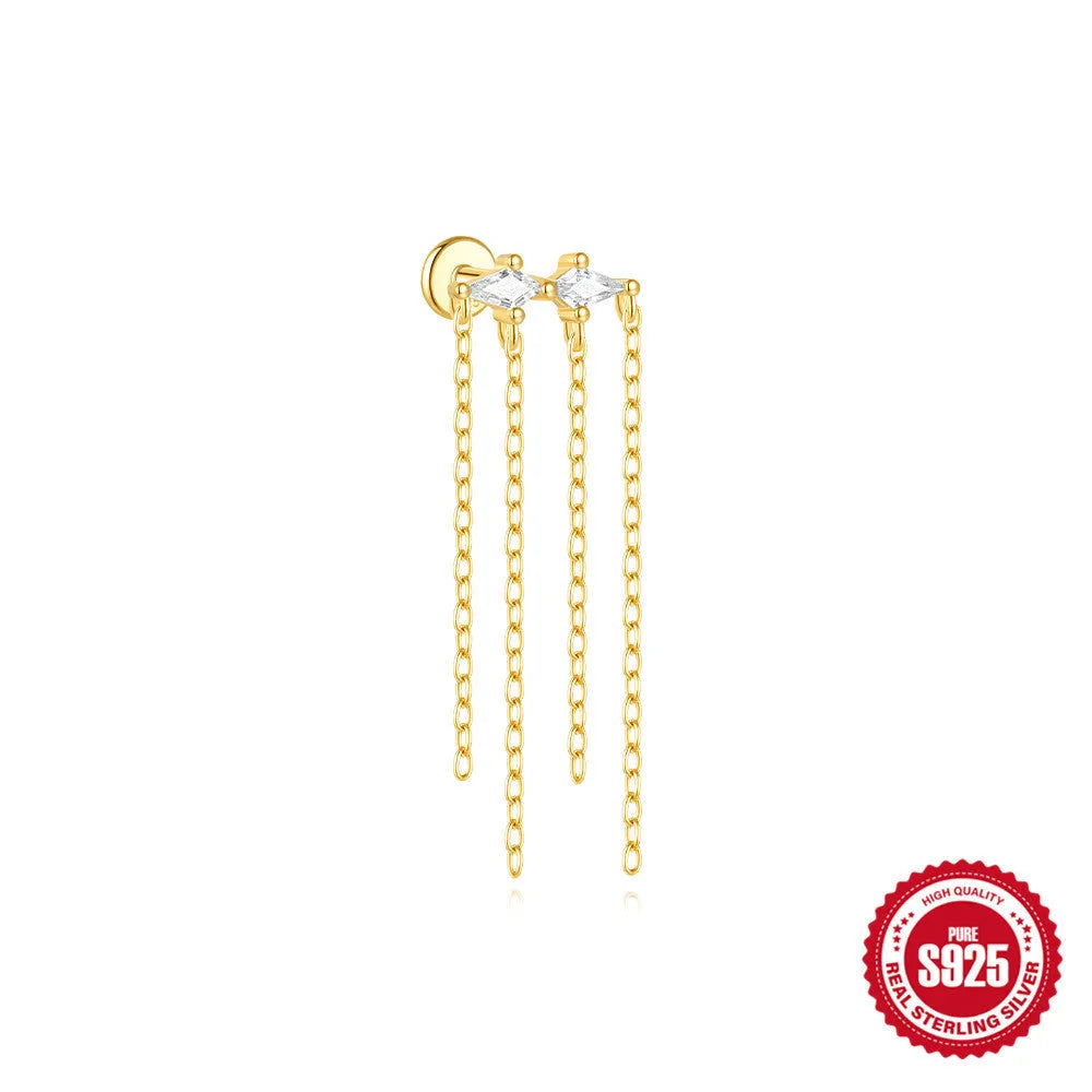 Geometric kite-shaped sterling silver earring with rhinestone head and gold chain tassel.