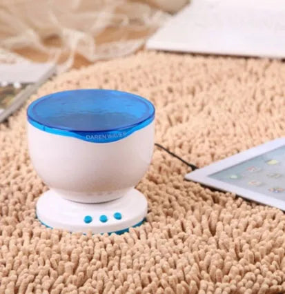 Blue ocean and starry sky LED projection lamp on a surface