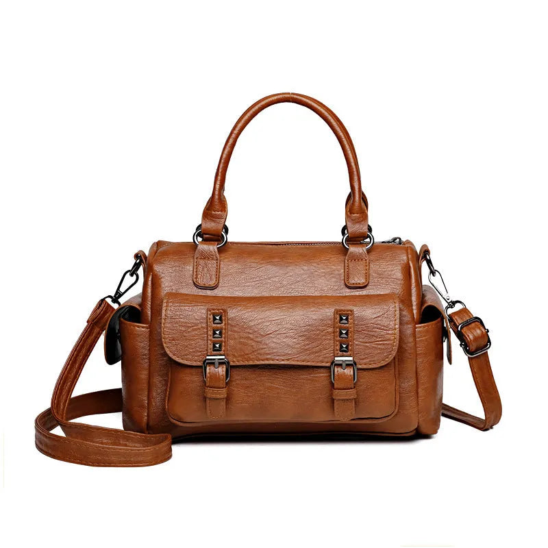 Vintage messenger bag in horizontal square shape showing contrast stitching details and shoulder strap