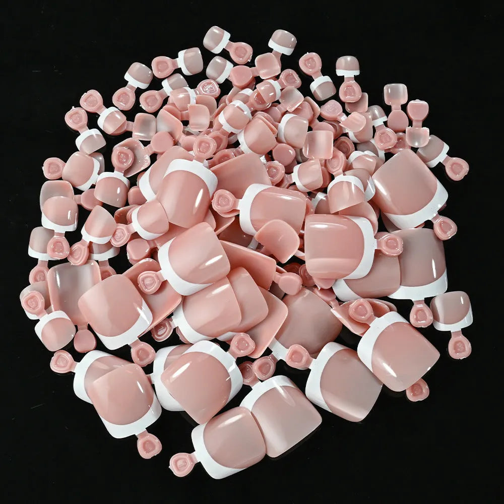 Box of 120 French white edge full square short nude toe nail tips on a white background.