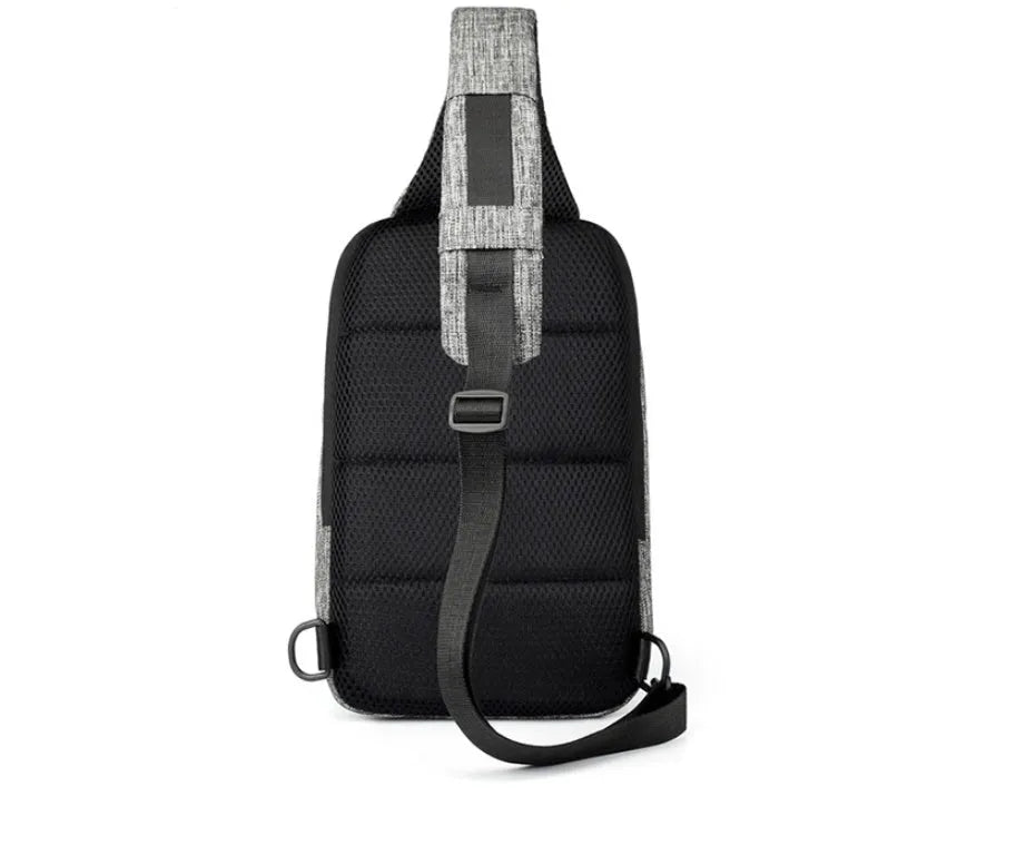 Small dark blue oxford cloth waterproof chest bag with a single strap and zipper.