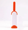 Reusable pet hair removal brush with double-sided roller and self-cleaning base