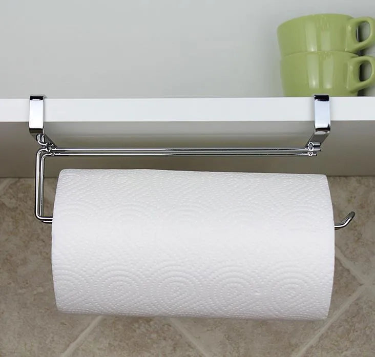 Silver stainless steel paper towel rack mounted on kitchen cabinet door back