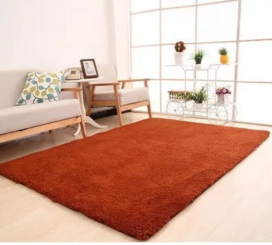 Solid colour plush area rug with non-slip dot-patterned bottom in rectangular shape