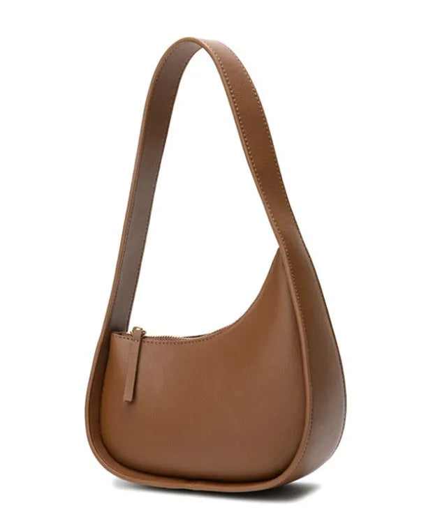 Small half moon shaped leather shoulder bag with wide strap in four colour options