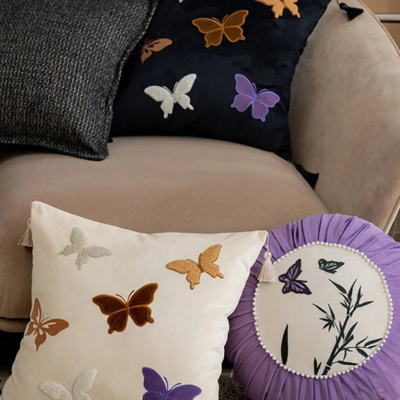 Square beige cushion with black and purple Chinese butterfly embroidery