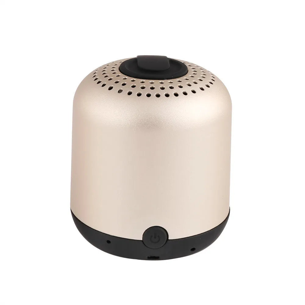 Hieha XQ11 cylinder-shaped mini Bluetooth speaker in silver colour on a table