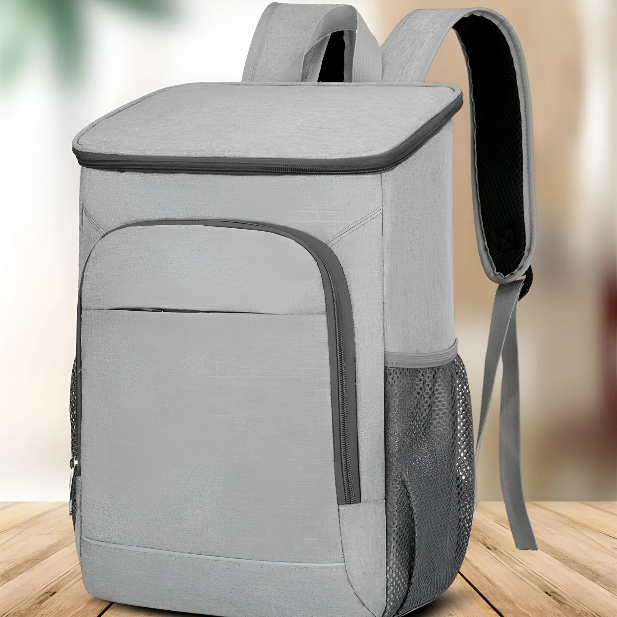 Large outdoor thermal picnic backpack in grey-orange colour with curved shoulder straps and compartments.