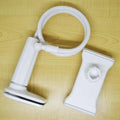 Black bedside oversize flat panel mobile phone holder with adjustable long arm on table