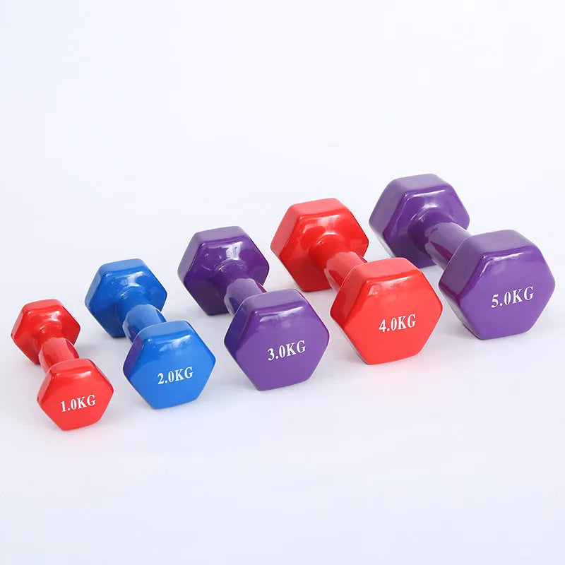 Colourful plastic fitness dumbbells in bright colours with glossy surface coating