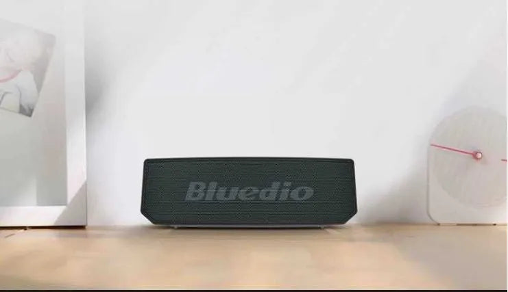 Black Bs-6 cloud smart speaker showing compact dimensions and speaker grille