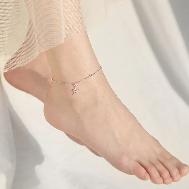 S925 sterling silver anklet with a starfish charm and round beads on an adjustable chain.