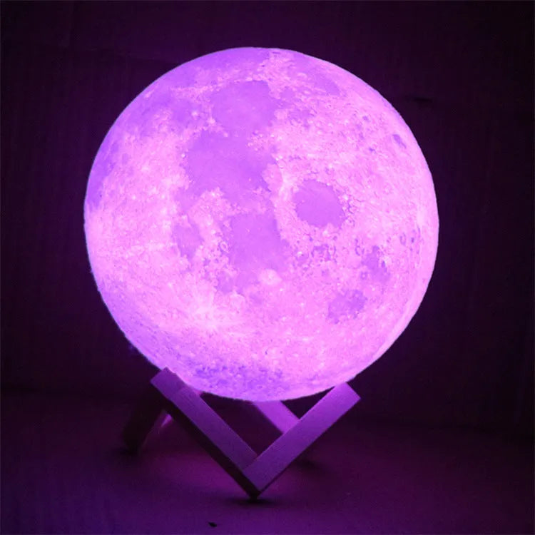 3D printed white moon lamp on wooden stand with colour-changing LED light