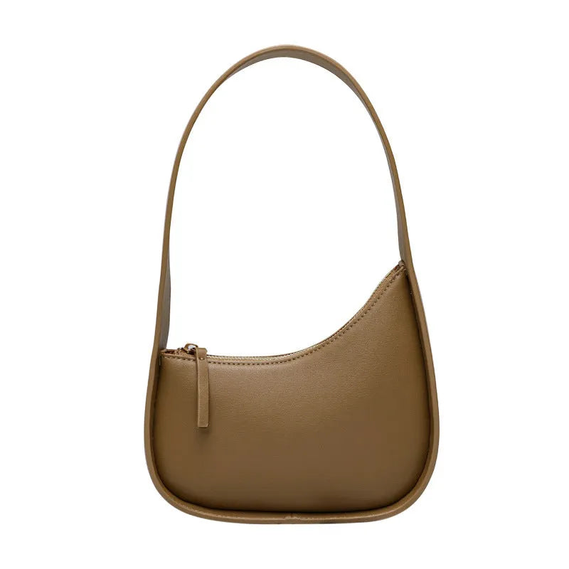 Small half moon shaped leather shoulder bag with wide strap in four colour options