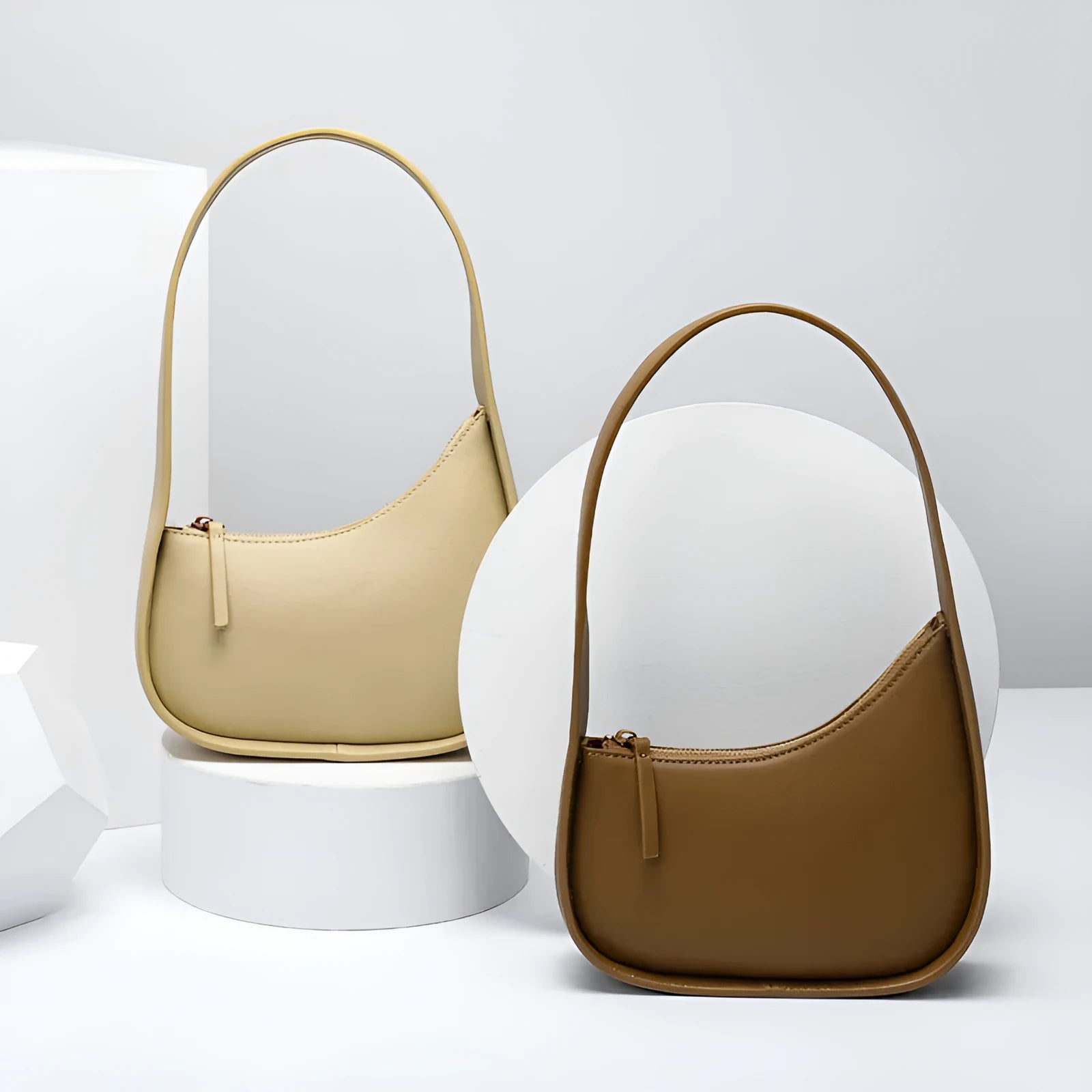 Small half moon shaped leather shoulder bag with wide strap in four colour options