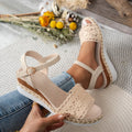 Beige closed toe wedge sandals with buckle fastening and leather upper for women