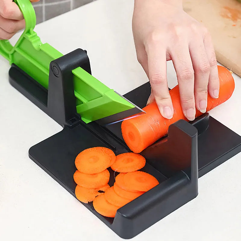 Green plastic vegetable cutter with stainless steel blades for cutting carrots and potatoes