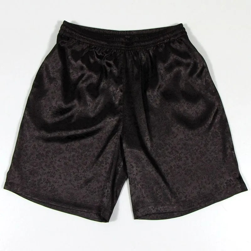 Men's black Tang Suit Tai Chi shorts with a white drawstring elastic waistband laid flat.
