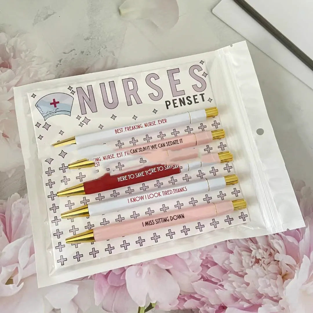 Set of five blue nurse-themed retractable ballpoint pens with plastic casing.