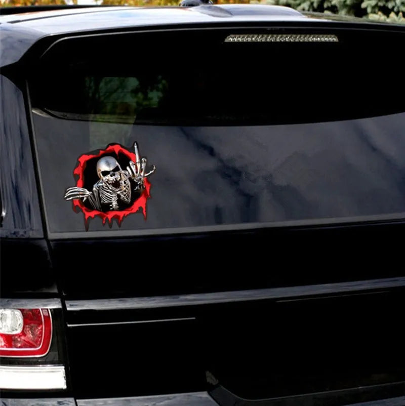Close-up of a colourful reflective metal skull car sticker with a broken shell pattern, measuring 15cm by 14cm.