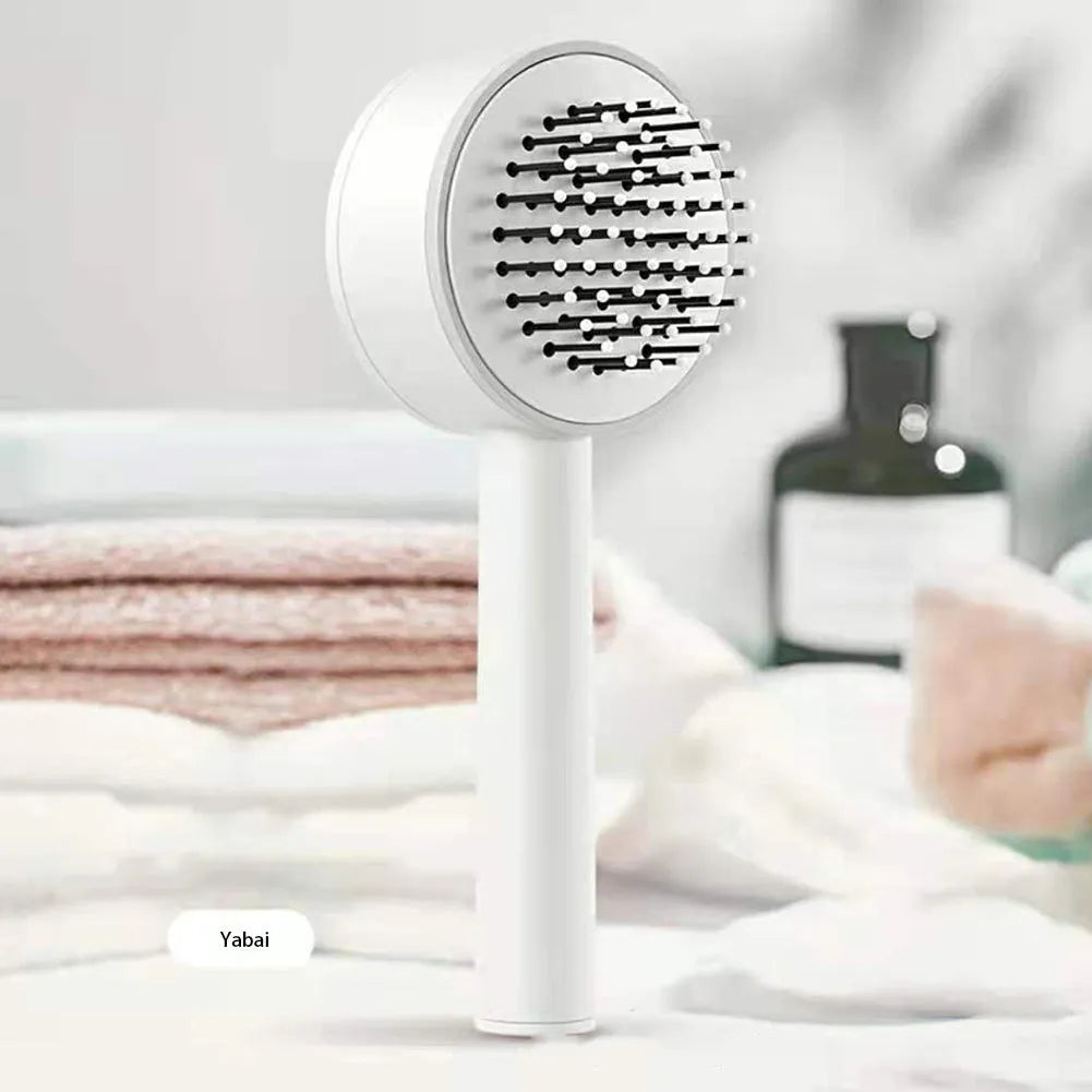 One-key self-cleaning hair brush with 3D air cushion and round-head pins, available in green, pink and white, size 20x9cm