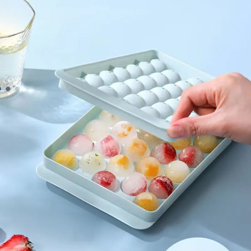 Blue silicone ice cube tray with lid showing 33 round grids, measuring 24x14x3cm